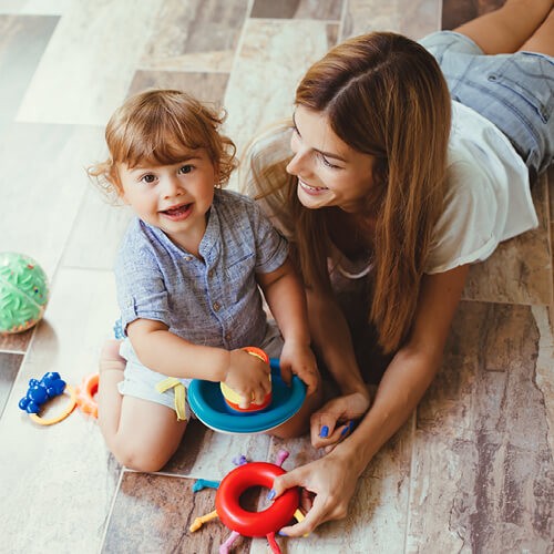 Mom with child playing | Burris Carpet Plus, Inc